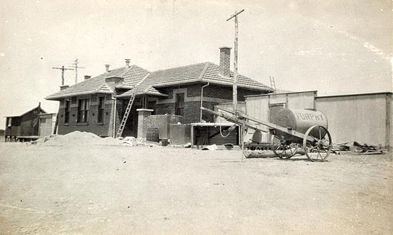 An old photo of the road-side view of the station building.