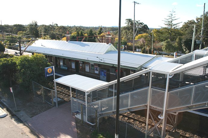 The view from the footbridge after the station was upgraded in 2005 as part of the Easy Access program. The walkway and stairs are now all covered and signage has been modernised.