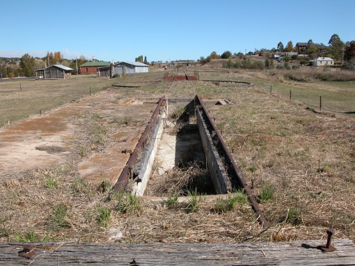 The base of the former engine shed and pit, looking towards the station. Just beyond the shed is the turntable.