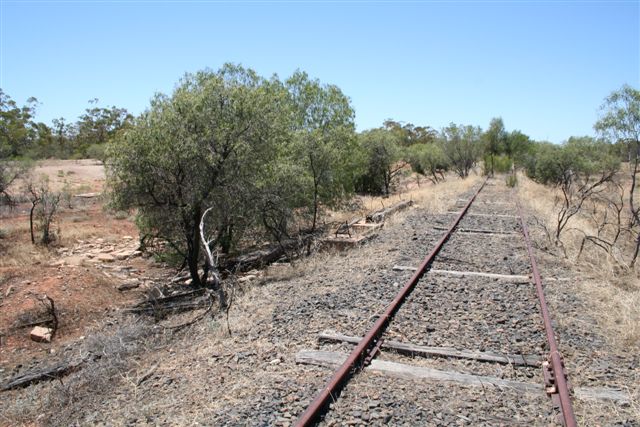 The view looking towards Nyngan with the water tank remains on the left of the track.