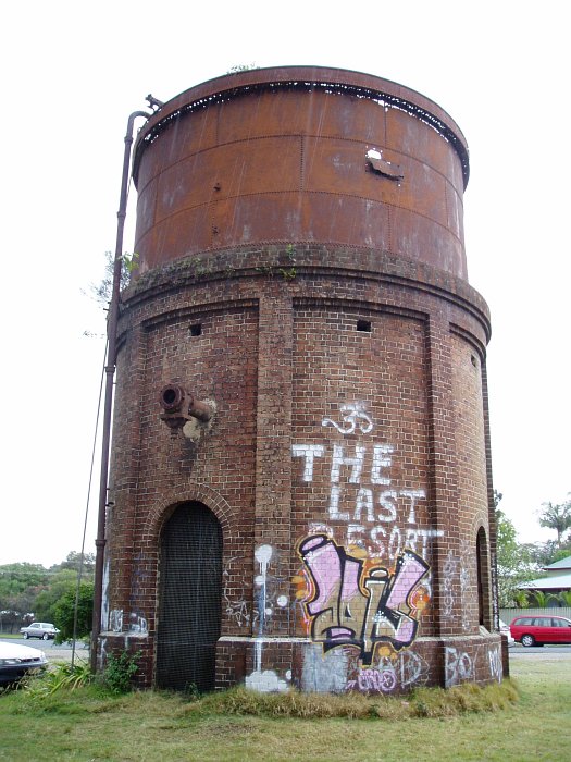 The unusual circular water tank looks to be in poor condition.