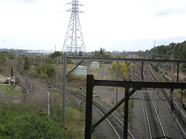 The view looking south from the Hume Highway overbridge. The track on the left is the Delec Siding, with the main goods lines on the right leading to Enfield Yard..