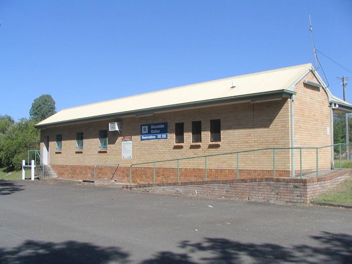 A road-side view of the modern brick station building.
