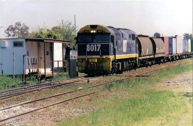 Cooks River Yard master office with Frame 'A'. The driver of the 80 class loco is exchanging the staff before proceeding.