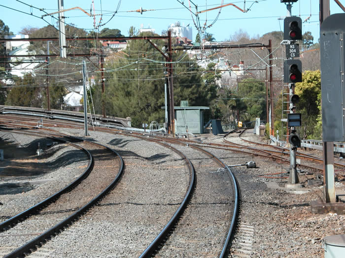 The junction of the North Shore line and the North Sydney car sidings line which branches off to the right and down the hill to Lavender Bay. The junctions leading to North Sydney Station middle platforms and tunnels 2 and 3 are just visible on the left of the picture.