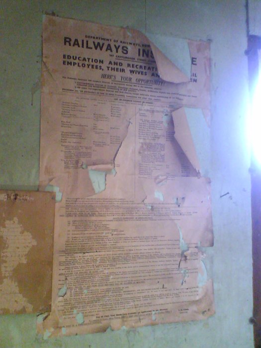 A peeling poster inside the remaining workers building at the quarry.