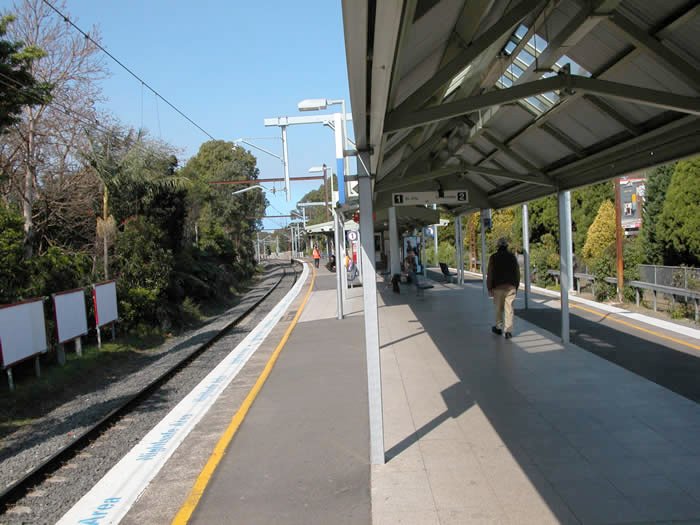 The view looking south along platform 1 towards the city.
