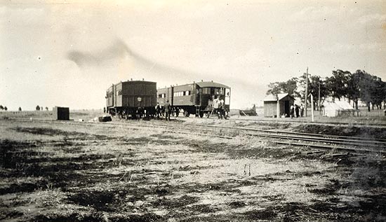An historic photograph of railmotors passing at Barnes.