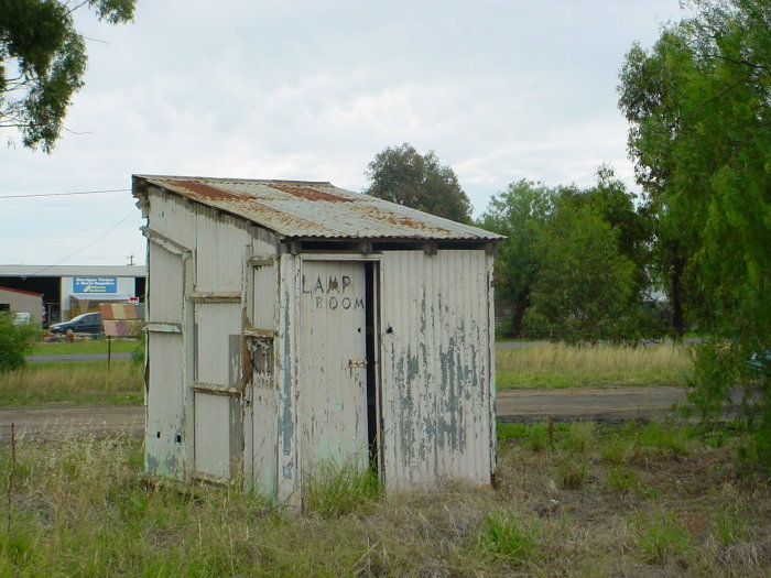 
A view of the small corrugated iron shed labelled "Lamp Room".
