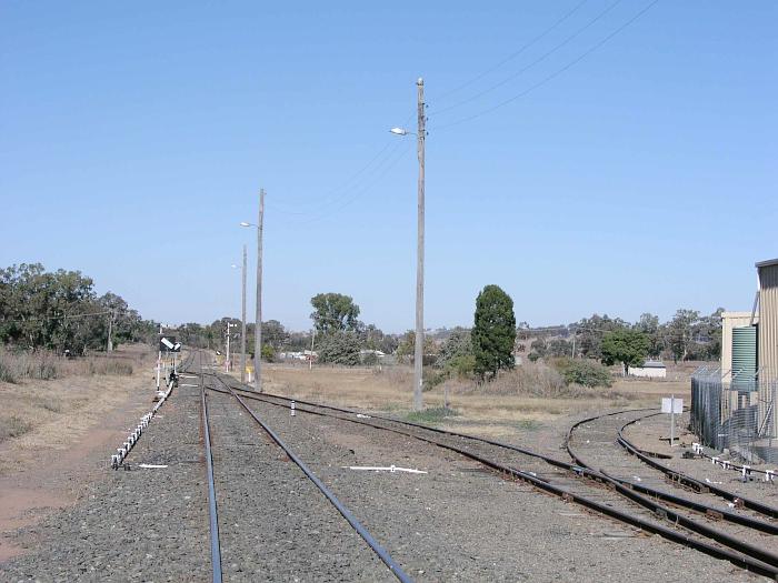 
The view looking south from the yard.  In the distance, are the lines
to Werris Creek and Merrygoen.  The track on the right is one of the legs
of the turning triangle.
