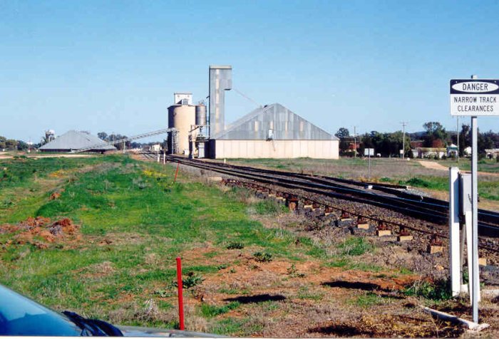 The view looking west. The station is visible in the distance under the inclined conveyor belt.