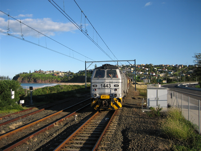 Independent Rail Australia loco 1443 with a tour train approaches Bombo Station from Kiama.