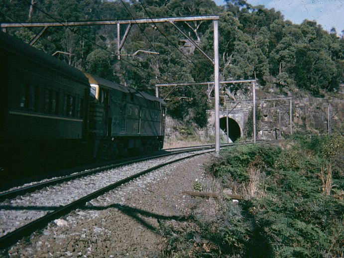 
An unidentified 442-class loco hauls a passenger train up Cowan Bank
past the portal of the abandoned Boronia No 5 Tunnel.
