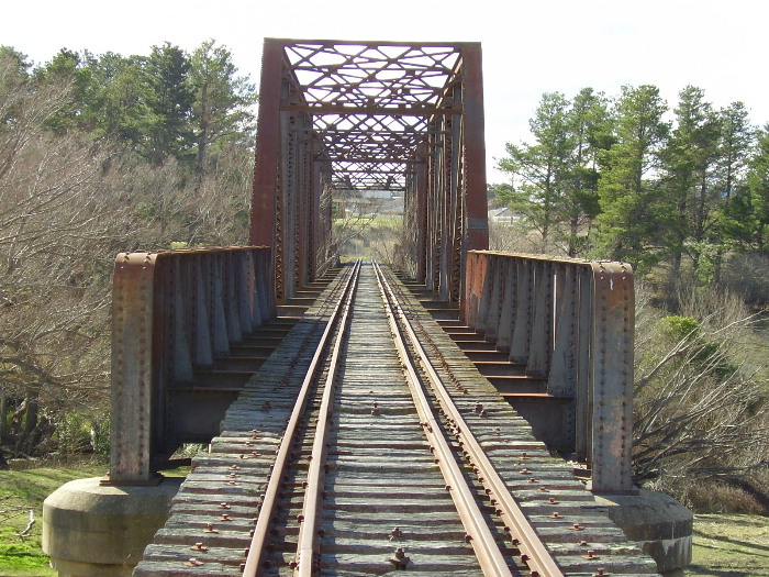 A view looking towards Crookwell of the decking of the Wollondilly River bridge at Goulburn.