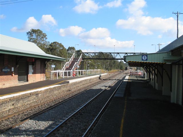 
The view from the up platform looking north.  An empty down coal train is
disappearing in the distance.
