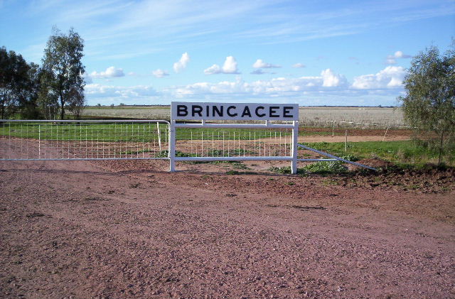 The station nameboard adorns the entrance of a property with the same name.  The property entrance is some 10km south of the rail line.