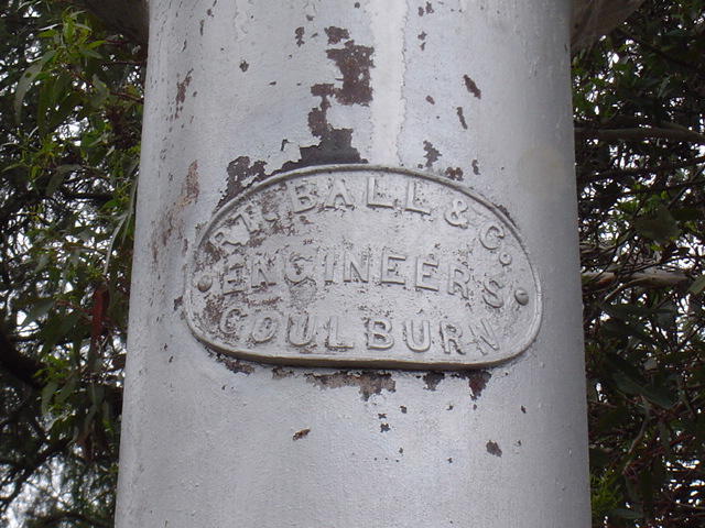 The manufacturer's plate on the water column.