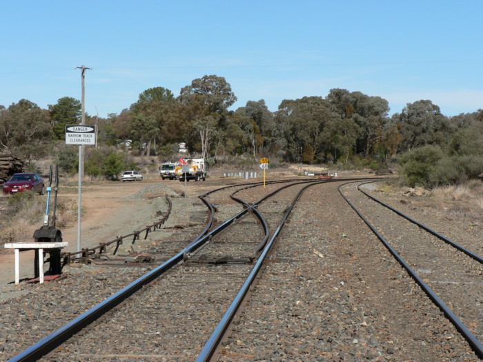 The view looking west. The goods siding in on the left, with the loop line on the right. The station was located just around the curve in the distance.