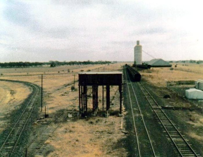The view looking west towards the water tank and turning triangle. The remains of the track at the left base of the tank served the coal stage and engine shed.