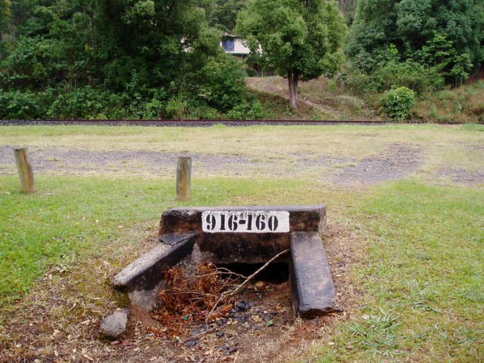 The distance marker on a small culvert about 100m on the up side of the former station.