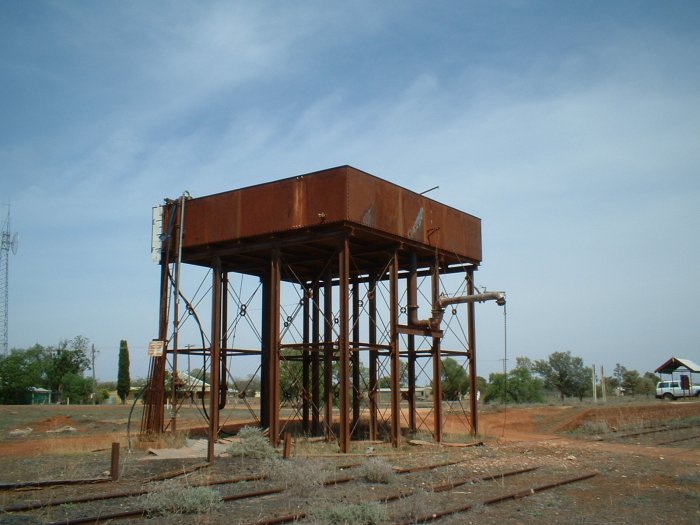 The water tower and crane at Byrock, taken in January 2007. The shelter on the platform in the background of both photos has a notice board with weather-affected historic photos and notes.