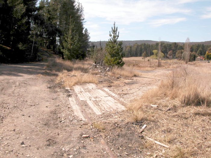 A piece of track is still embedded in the road crossing near the one-time location of Cal Colliery.