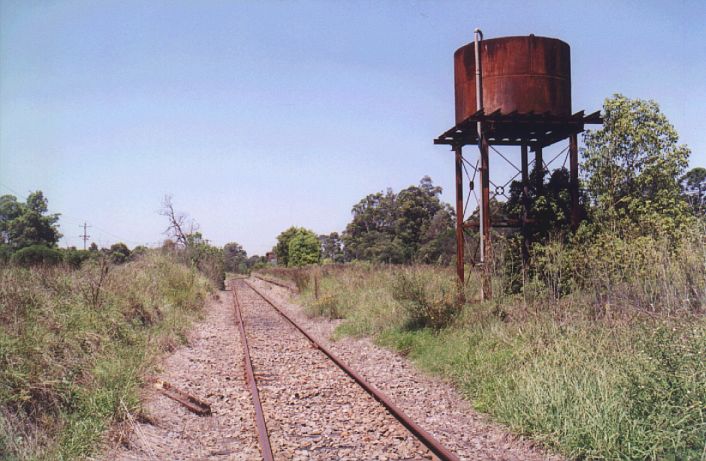 
The elevated water tank dominates the down end of the platform.  The up
platform face is just visible in the background.
