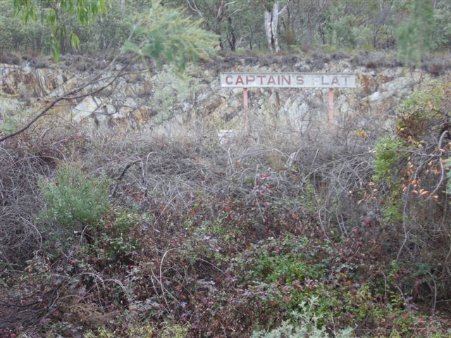 The station name board, visible from the road way.