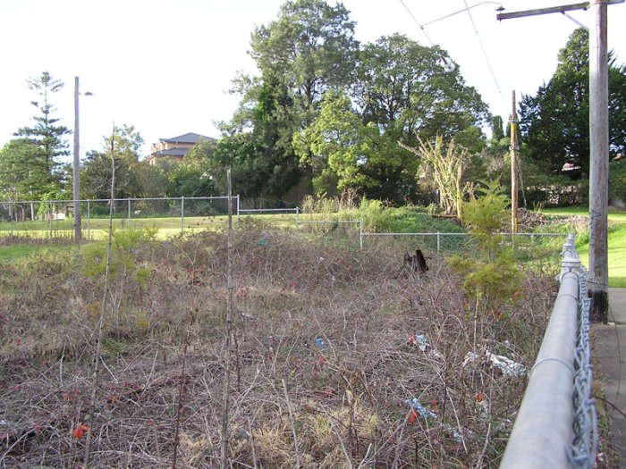 Looking north at the old end of the mainline, about 150m north of the station. The overhead is grounded just beyond the fence and Boundary Road is to the left.