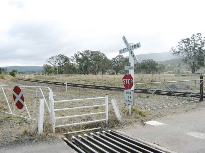 The station was located just beyond the white kilometre post.  A short goods siding was located on the far side of the tracks.