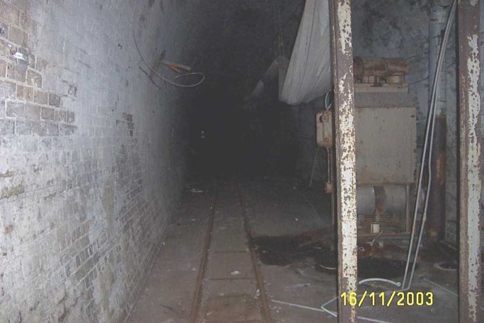 The interior of the tunnel. The small gauge track in the foreground was used by the mushroom farmer to remove the mushrooms to the packing shed. A small converted diesel tractor was used to run along this line.