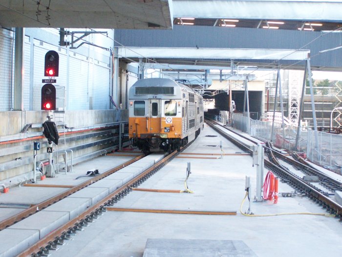 The view north from the end of the platforms, showing the four-track box beyond the station. Also note the half-built crossover.