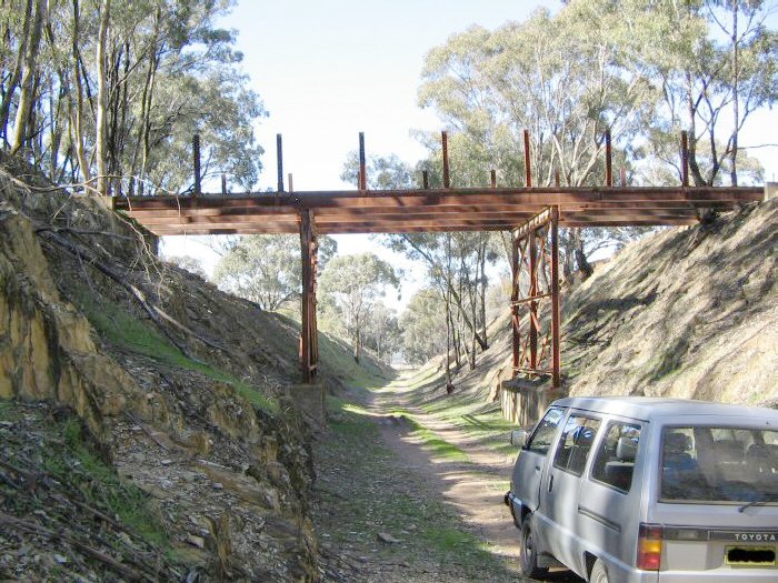 An incomplete road overbridge in the Comobello - Spicers Creek section. This section of the formation is used by local farmers to access their properties. The view is looking along the track in the direction of Gulgong.