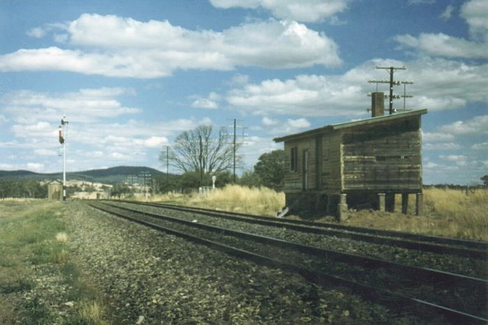 
All that remains of Coolalie in this 1980 photo was the abandoned signal box,
which once stood on the down platform. The former Up Starting signal is
on the left.
