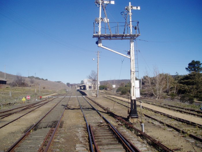 The view looking south past the signal post towards the station.