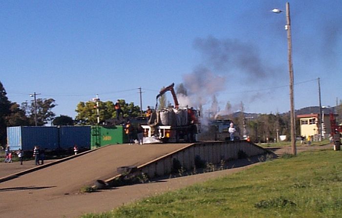 
The goods loading platform at Cootamundra with 3801 and 3830 being
re-coaled.
