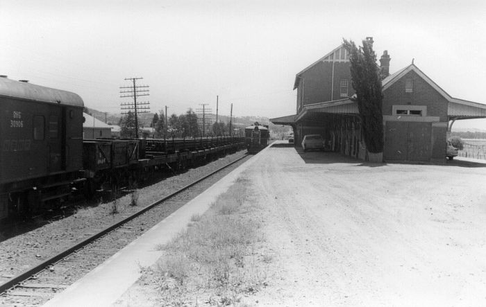 
A rail train and diesel railcar sit at the expansive station.
