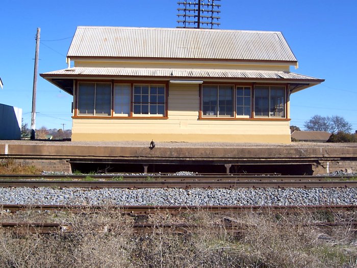 The view looking south at the signal box. Note the gap under the platform for the now-removed rodding and cables.