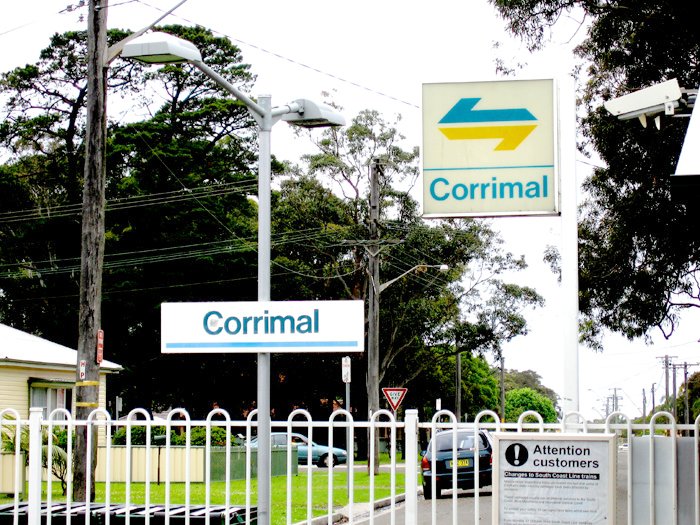 The old white CityRail style station signs at Corrimal.