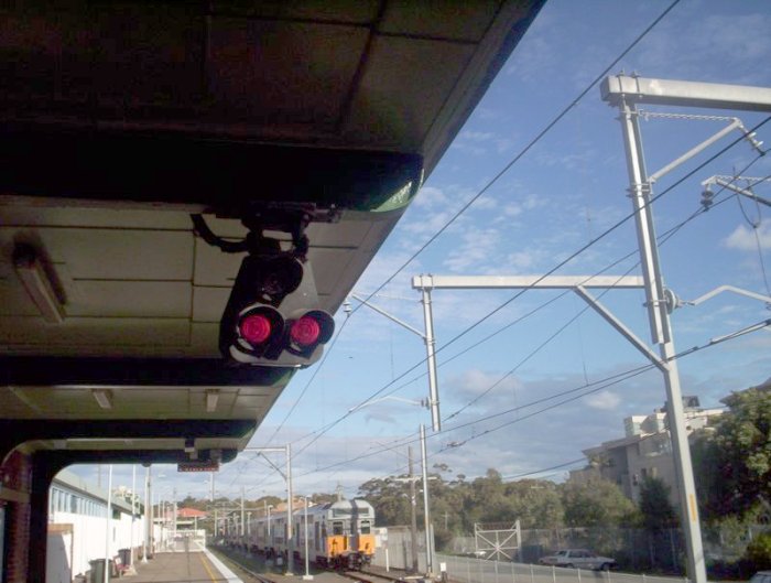 The unusual roof-mounted dwarf colour light signal at Cronulla.