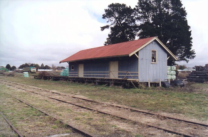 
A closer view of the goods shed reveals that the platform area is being used
to store wrapped bales of fodder.
