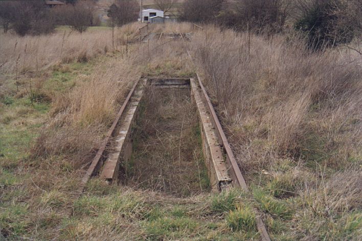 
The ash pit on the engine siding.  The turntable is visible a short distance 
further along.  This area is starting to disappear under the weeds.
