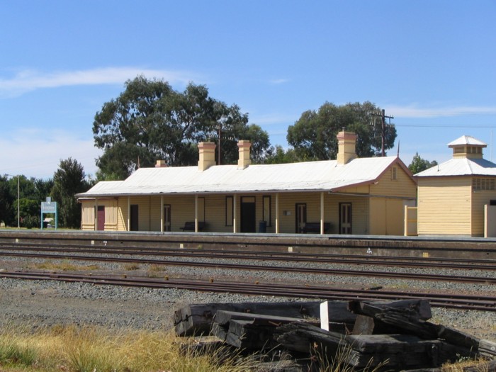 A close up view of the station building, with the line heading away to the right to Albury.