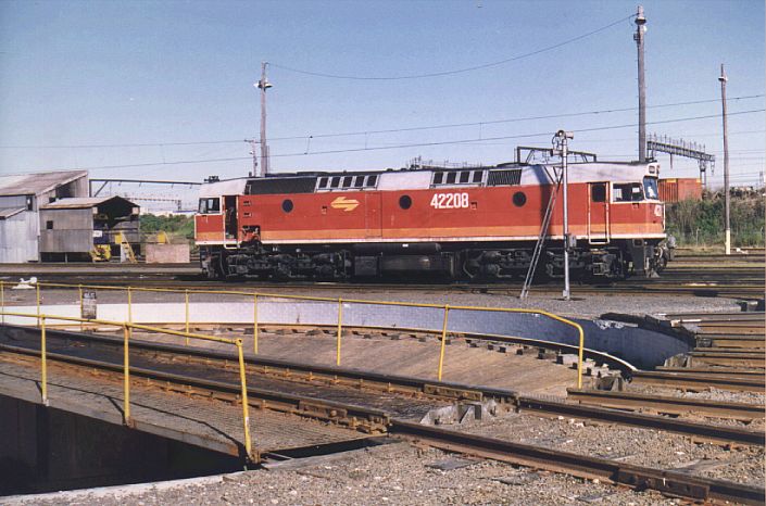 Candy-liveried 42208 stands idle next to the turntable during the
1996 Open Day.
