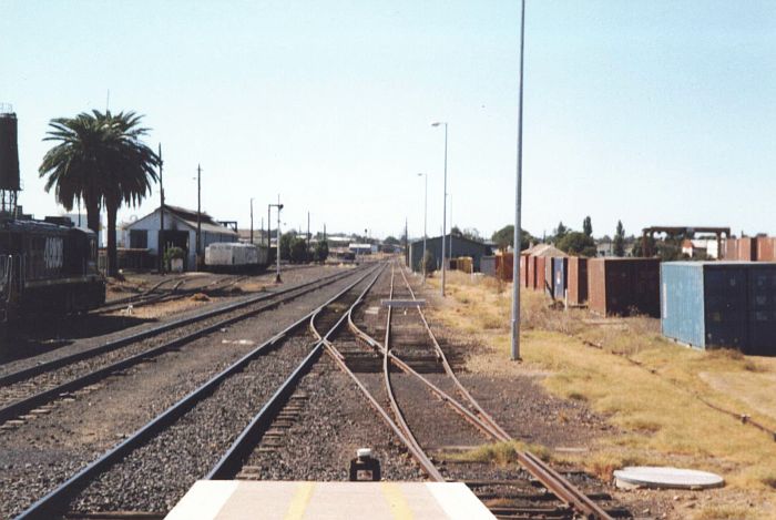 
Looking towards Sydney/Werris Creek. Dubbo Loco on left, and container
facility on right.  Approach to the short bay platform on bottom right,
which was just long enough for a CPH and CTH combined set to be stabled.
