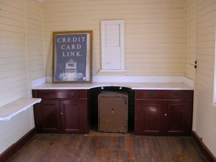 
A look inside the old ticket office. A few broken windows are the
only damage that has occurred since the station closed September
1975.
