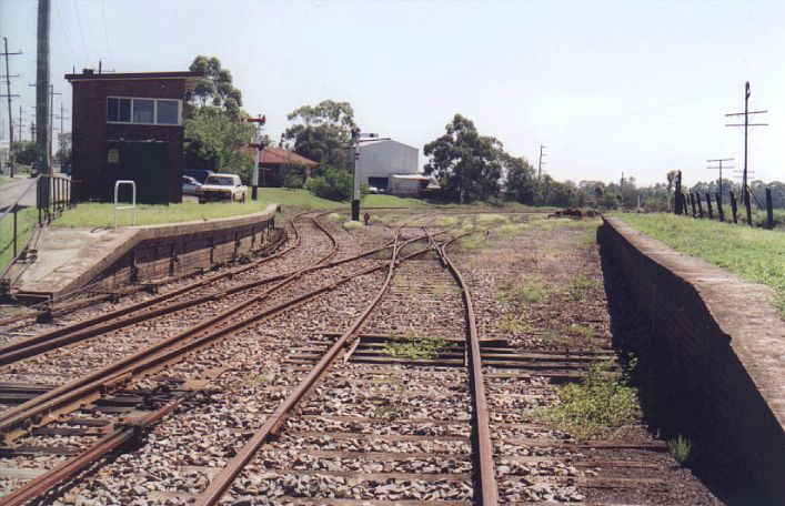 
The remaining trackwork at East Greta Junction.  In the background, the
line curves to the right where it meets the Main North line.  The
signal box is still in use.
