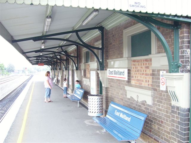 The bricked-up windows of the now unattended East Maitland station . This view of the island platform looking towards Maitland. The  two lines on the extreme left are the Coal Roads.