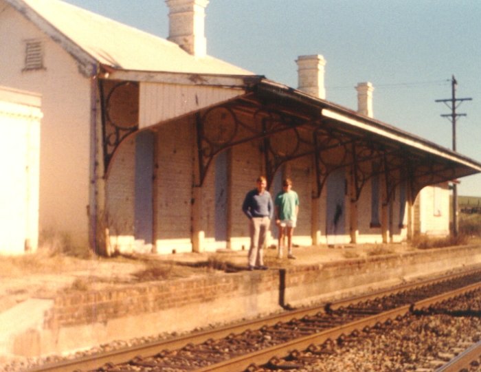 The view looking west along the down platform when the building was still present.