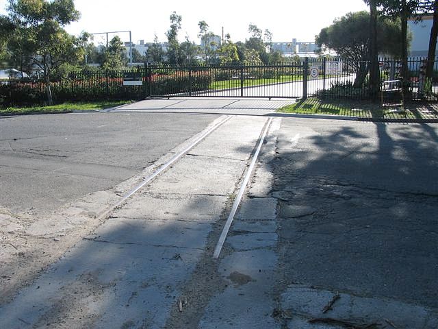 
Where ther Ampol siding crossed Baker Street, the tracks are still present
in the road.  This is looking back up the line.
